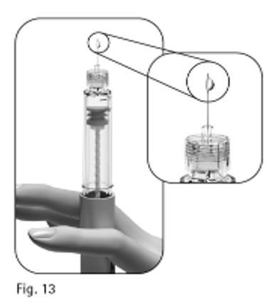 Figur 13: En droppe visas på nålens spets